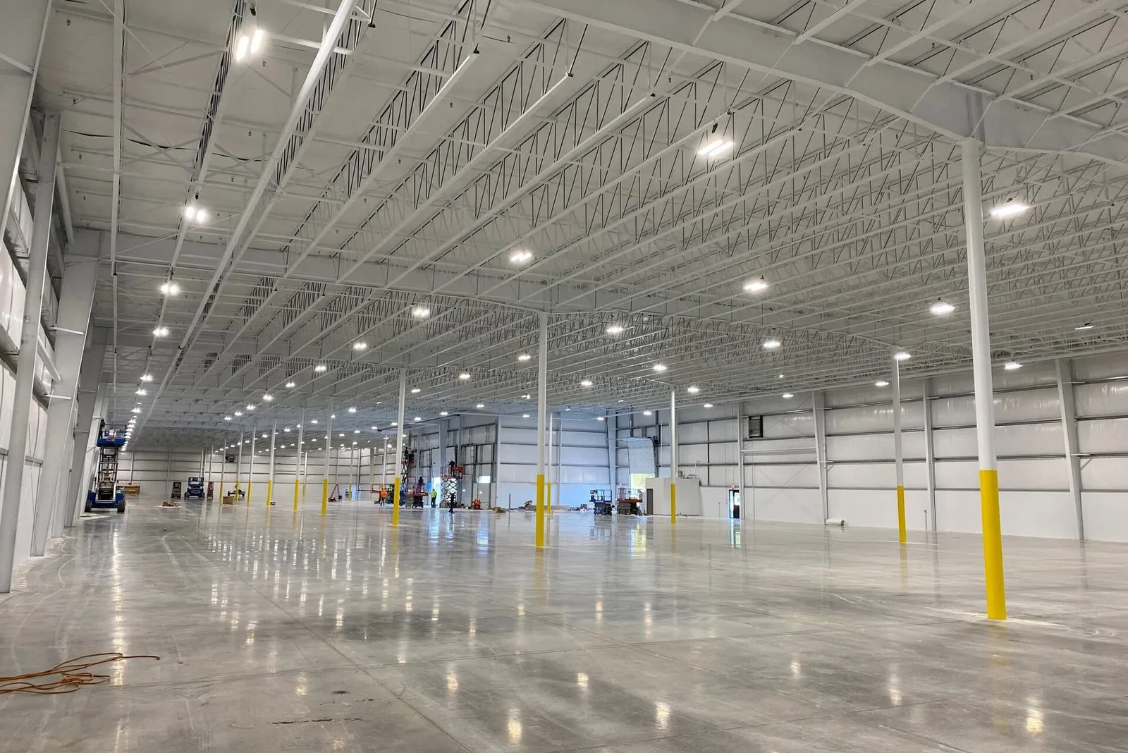 Specialty Industrial Finishes — freshly painted Genie boom lift