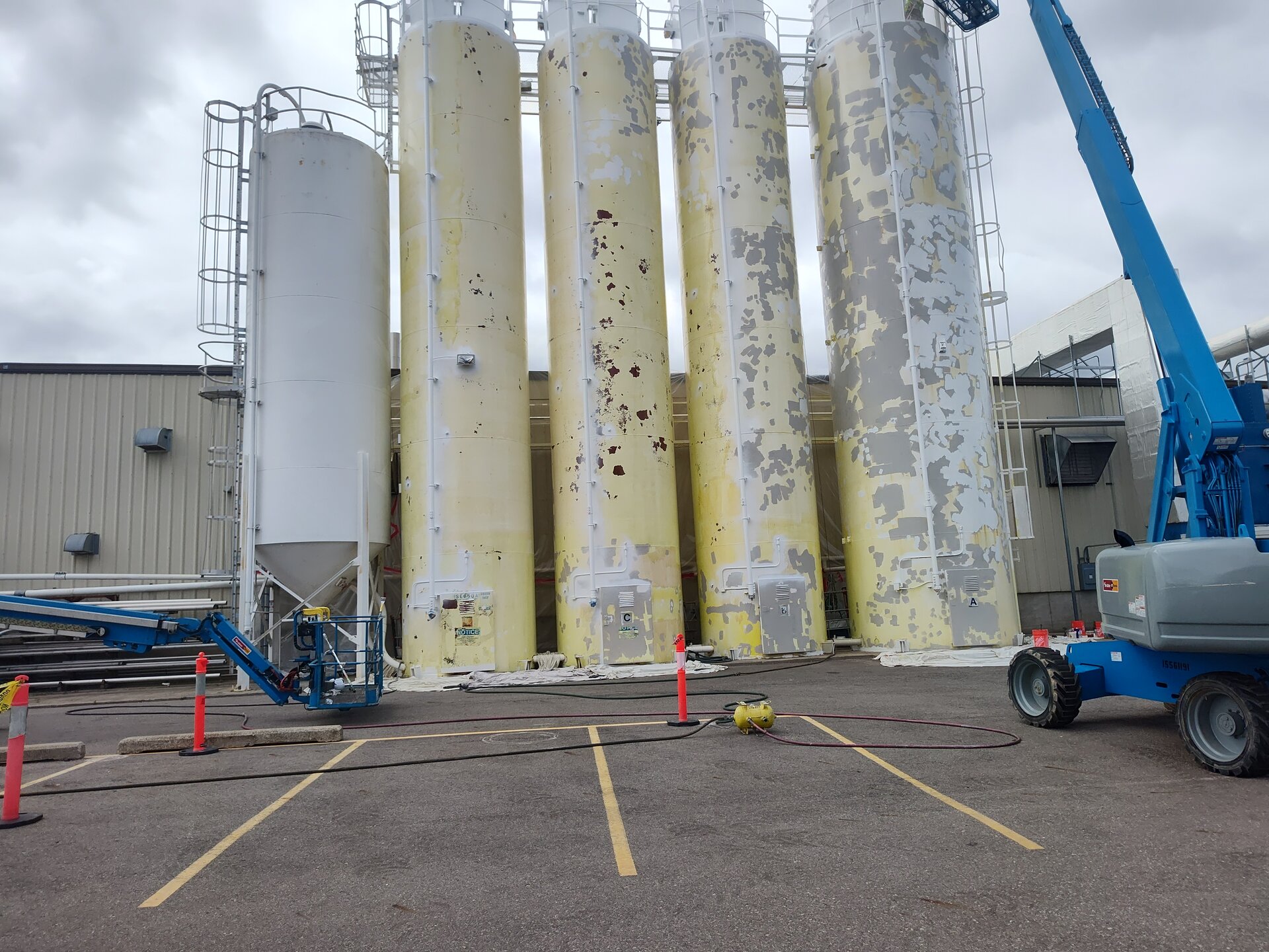 Chemical plant storage tanks — full exterior view after repaint with industrial coating
