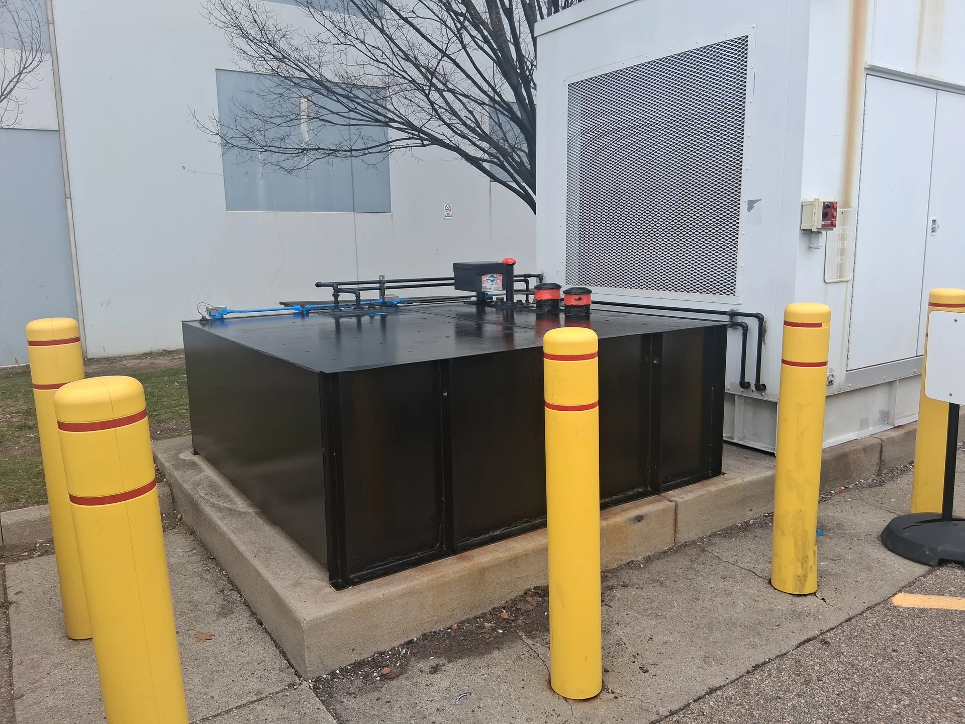 Ground-level fuel tank after repaint, corrosion removed and refinished