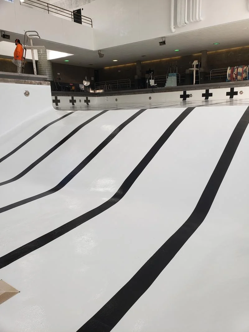 Completed pool recoat viewed from the deck, lane lines and target crosses finished