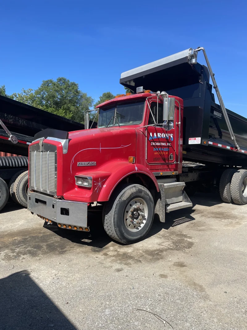 Aaron's Excavating Kenworth dump truck cab finished in matching red