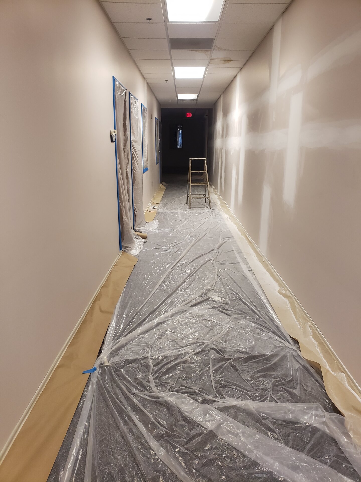 Church hallway repaint — walls masked and coated