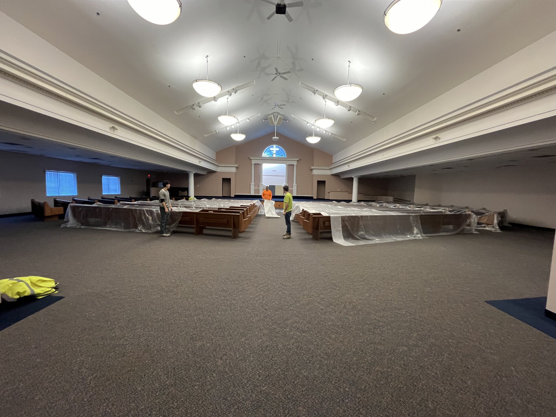 Exterior setup — crew equipment and lift truck on site