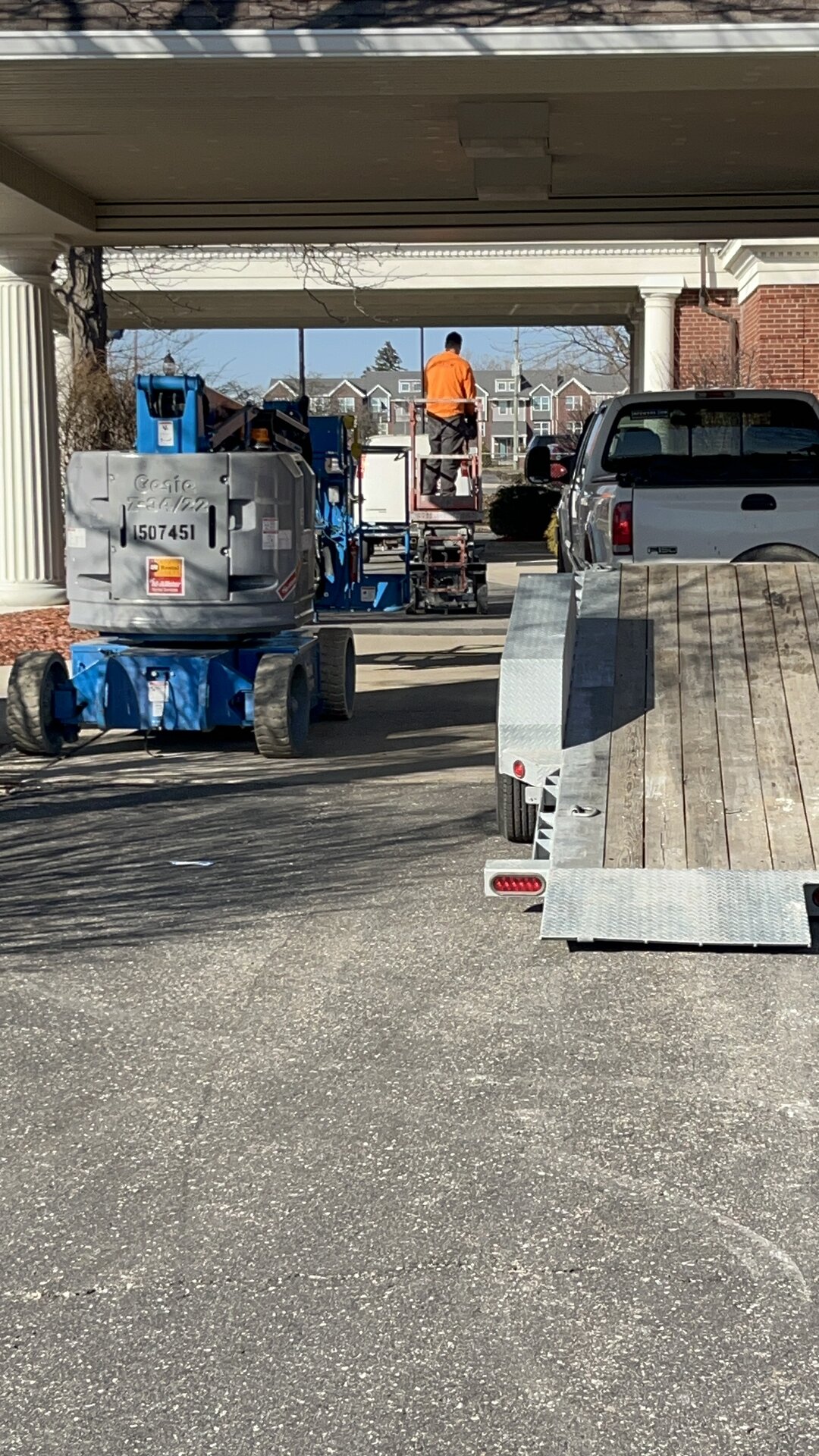 Exterior aerial view — Endurance Painting crew and equipment at church site