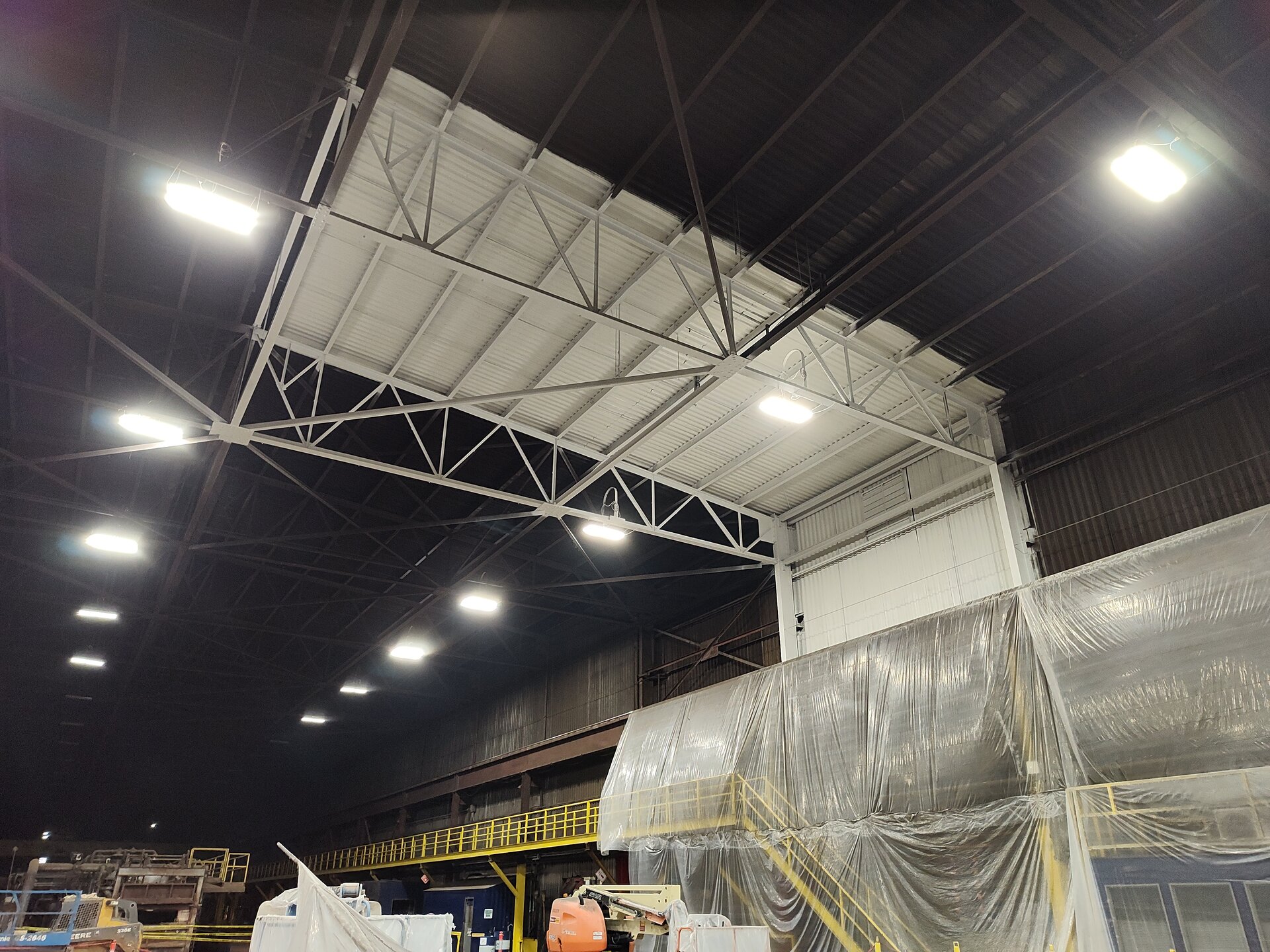 Industrial steel mill sample area — masking and preparation for coating in active facility