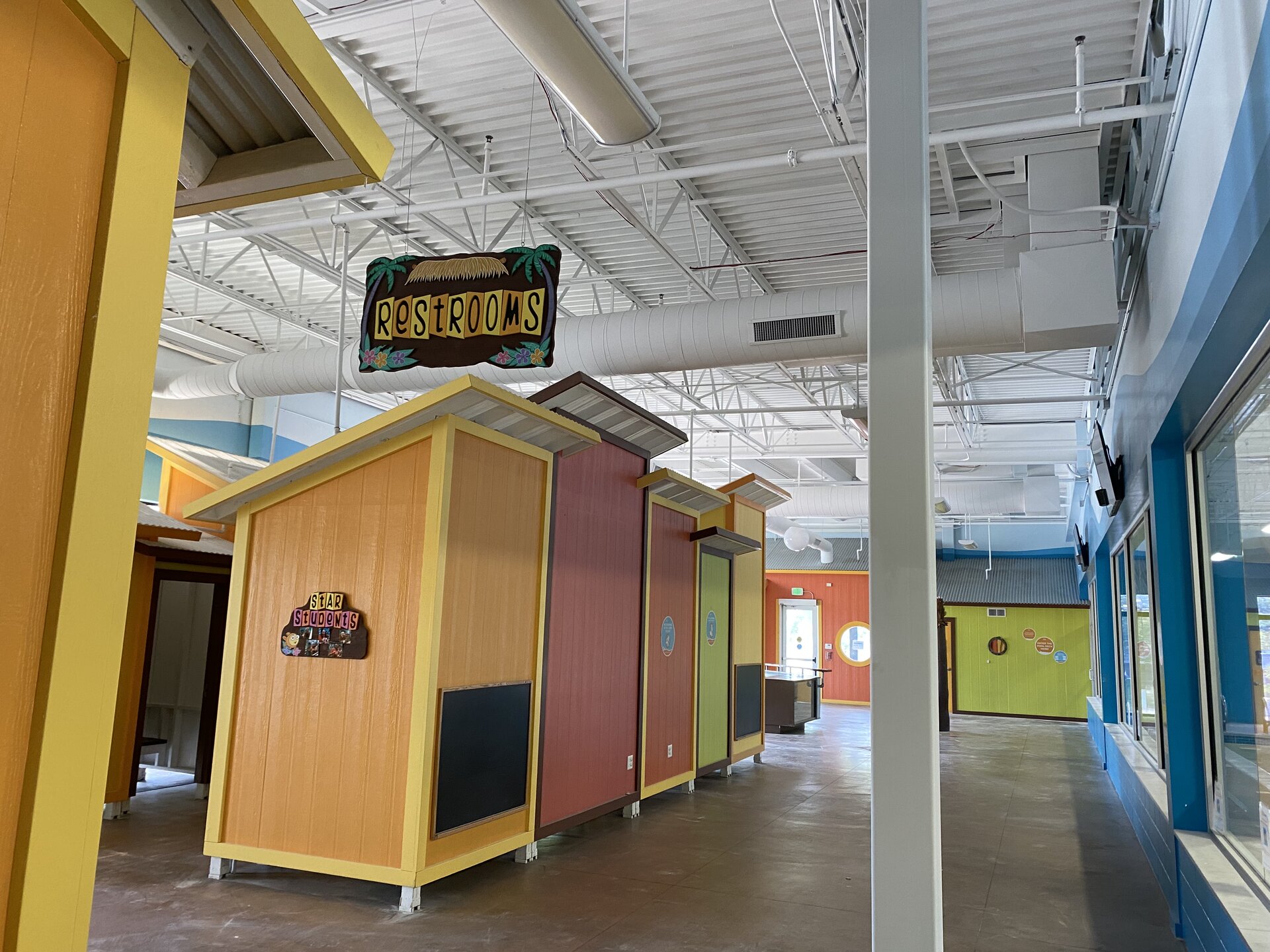 Goldfish Swim School interior — freshly painted walls and pool deck area