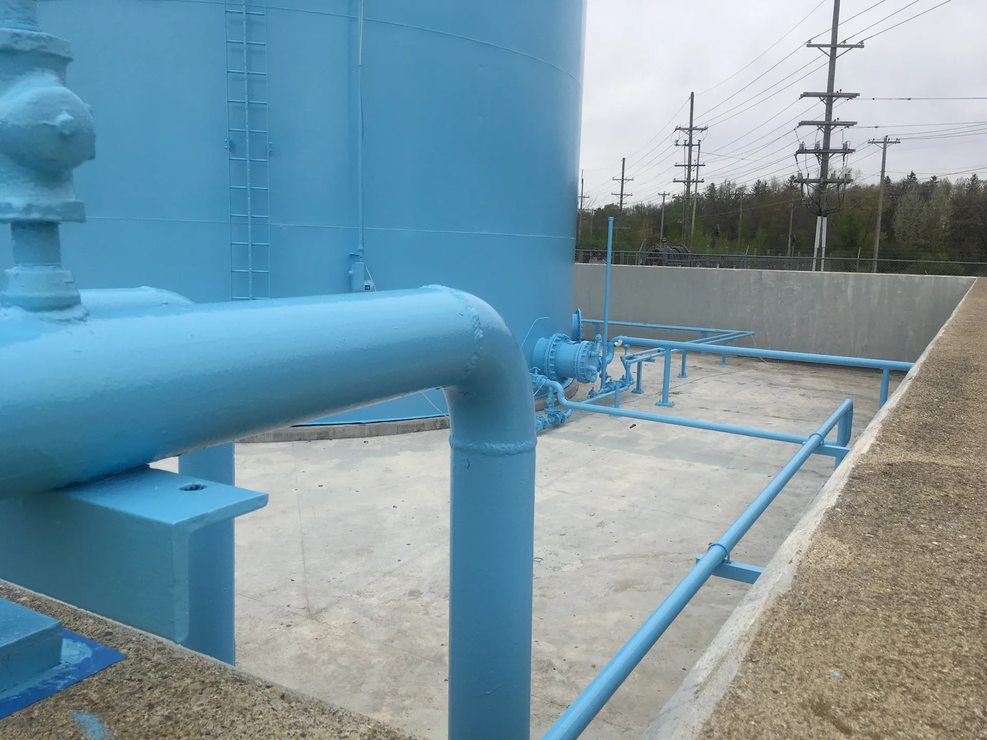 Rooftop piping and valves on the tank, freshly coated