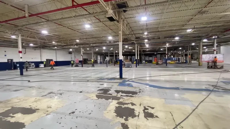 LuxWall plant interior with painted columns, ceiling, and new buildout walls under containment