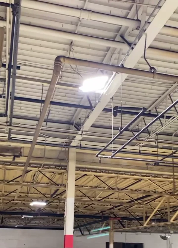 LuxWall facility ceiling and structure before cleaning and painting