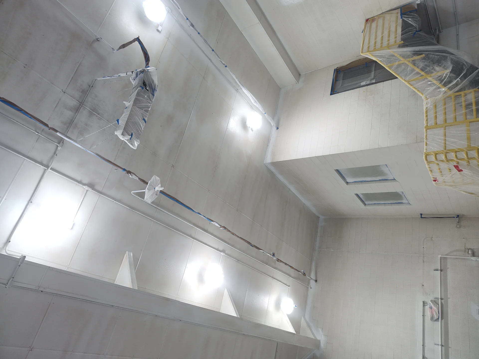 Powdered milk production facility — repaint in progress, walls and ceiling brought to clean white finish