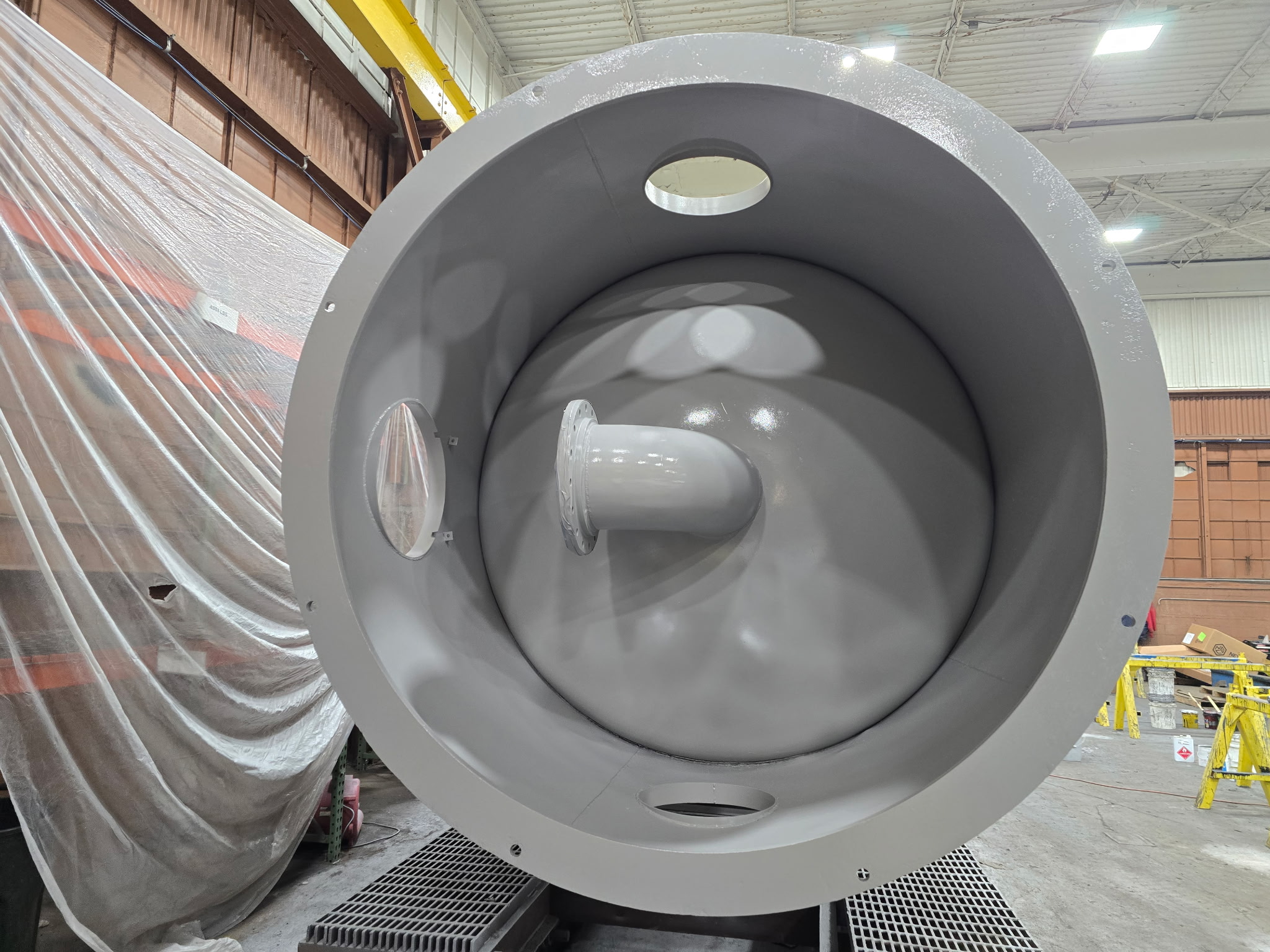 Interior end view of coated silo showing smooth specialty coating throughout