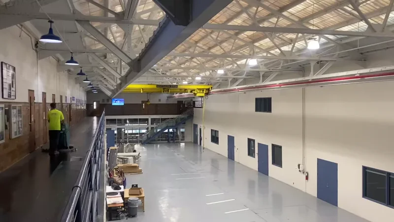 University of Detroit Mercy engineering atrium — finished walls and floor viewed from the mezzanine walkway