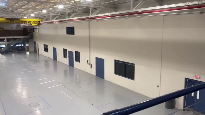 University of Detroit Mercy engineering atrium — freshly painted walls, doors, and floor