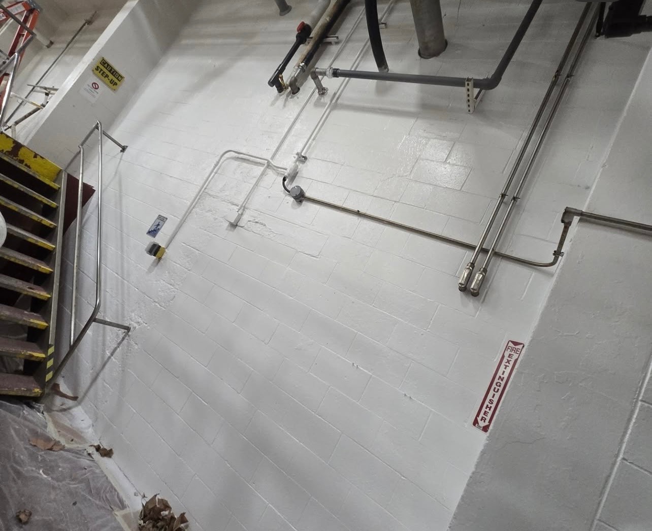 Overhead view of freshly painted white floor surface