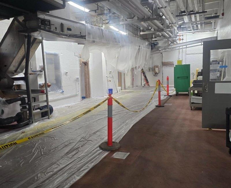 Production area during painting with caution barriers in place