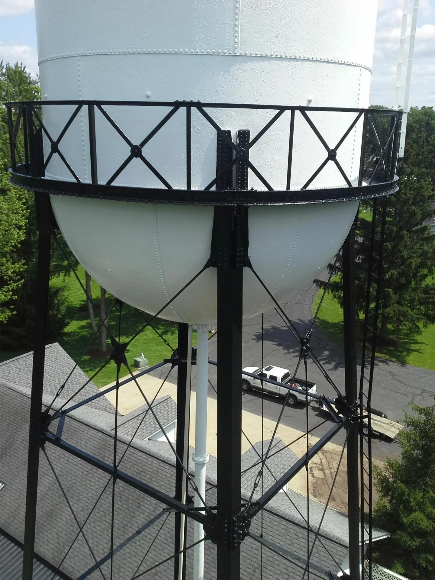 Close-up of the repainted tank from the lift, fresh white finish