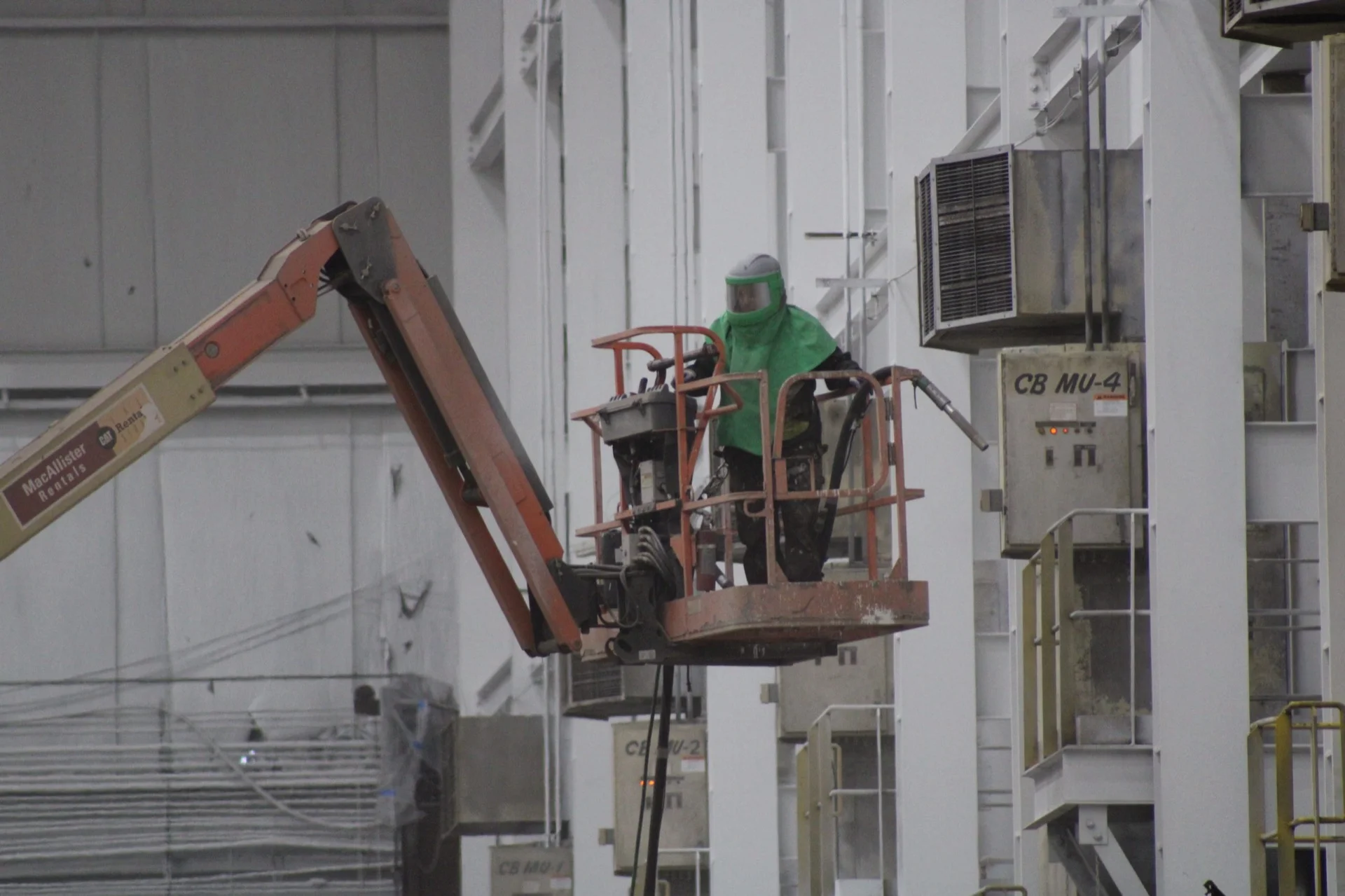 Protective coating application on facility walls and piping systems